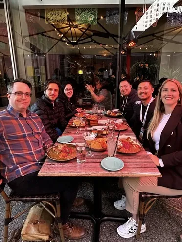 Quickhubly team members having dinner at GDC